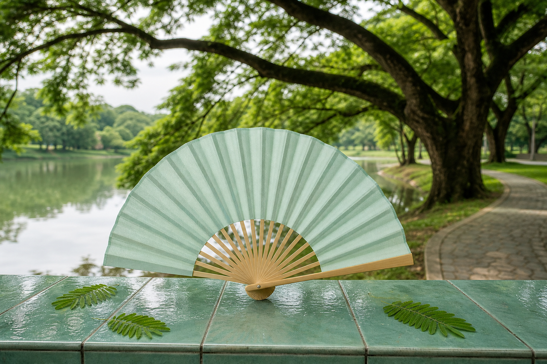 Plain tai chi fan on a jade green tiled ledge in a quiet lakeside park in the early morning, a calm start to low impact exercise